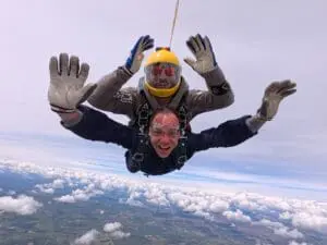 Serhii Titomyr captured mid-skydive during a charity jump for the Children’s Bereavement Centre, smiling as he freefalls through the sky.