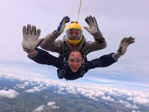 Serhii Titomyr captured mid-skydive during a charity jump for the Children’s Bereavement Centre, smiling as he freefalls through the sky.